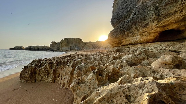 The dramatic golden cliffs and sea caves of the Algarve coast, a must-see region for any trip to Portugal.