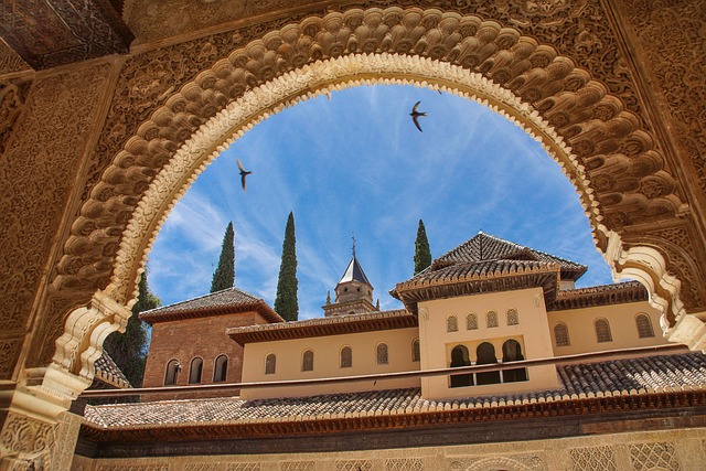 The magnificent Alhambra palace overlooking the city of Granada at sunset.