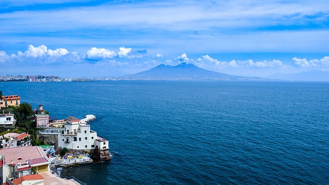 A vibrant street scene in Naples with Mount Vesuvius in the background, the authentic heart of Southern Italy.