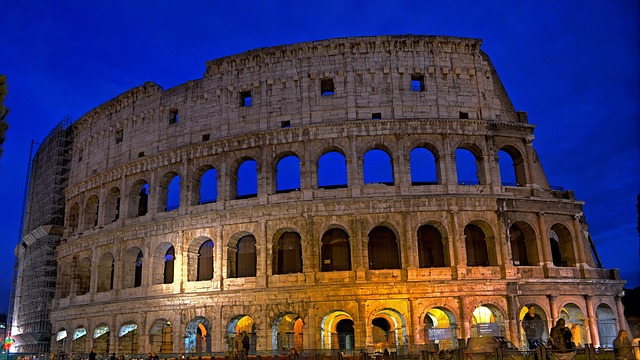 The Colosseum in Rome against a twilight sky